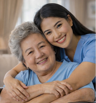 Caregiver embracing senior woman with warmth and reassurance at home